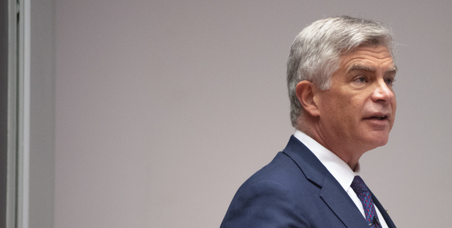 Side view of Philadelphia Fed Presiden Harker speaking