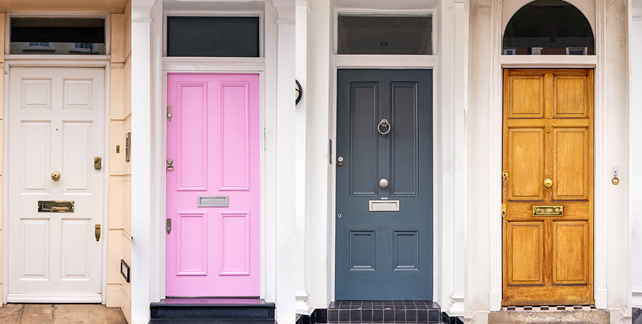 A row of four colorfully-painted doors.
