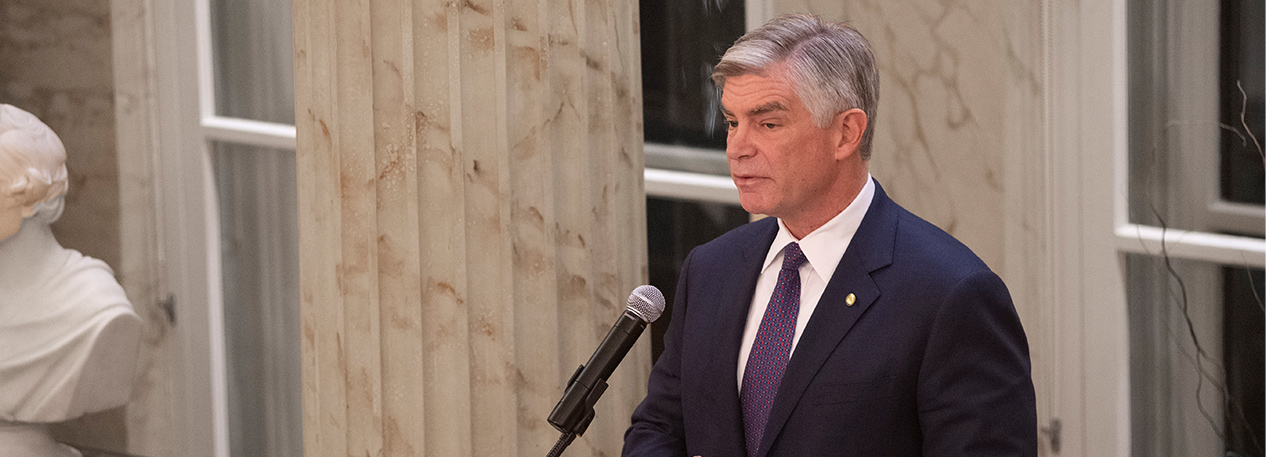 Federal Reserve Bank of Philadelphia President Patrick Harker speaking into a microphone