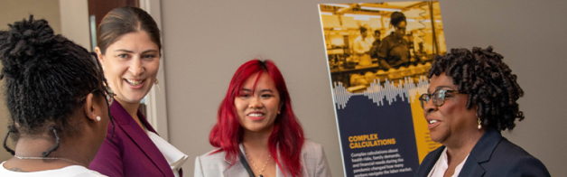 Ashley Putnam talks with workers who participated in the Worker Voices Project.