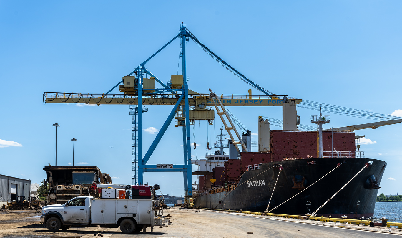 A large ship is docked at a port in Camden, New Jersey.