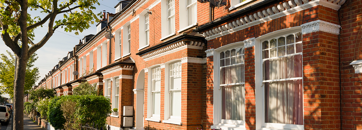 Brick row homes on a sunny day.