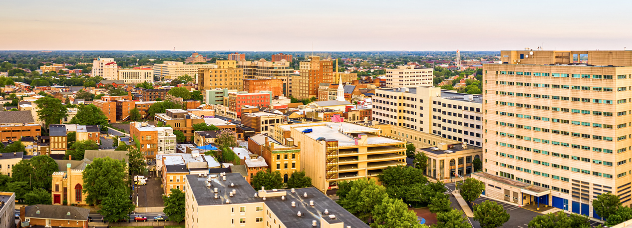 A view of a city at sunset.