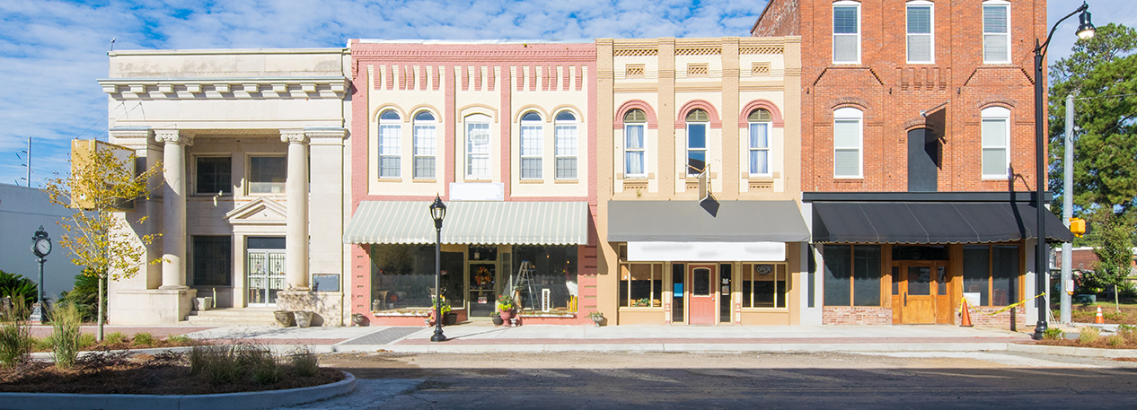 Store fronts with awnings along a small-town main street