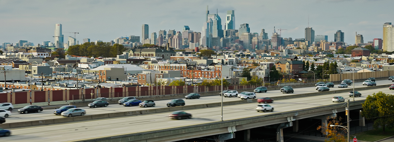 Philadelphia skyline with traffic in the foreground