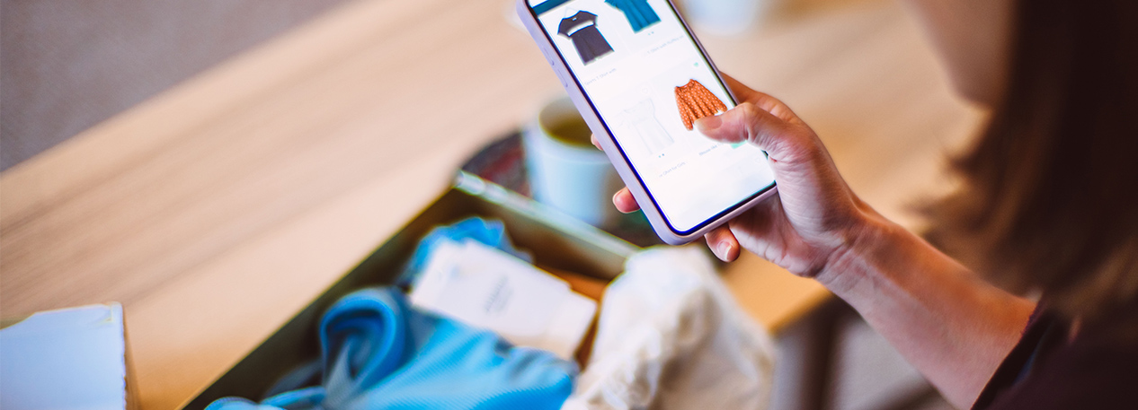 A woman shopping on a cell phone
