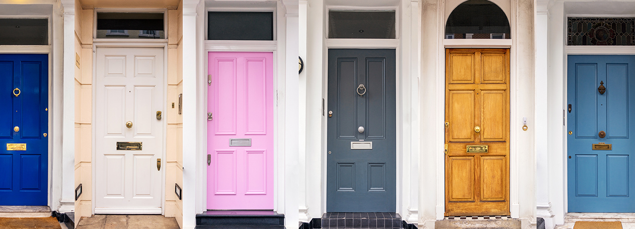 A row of four colorfully-painted doors.