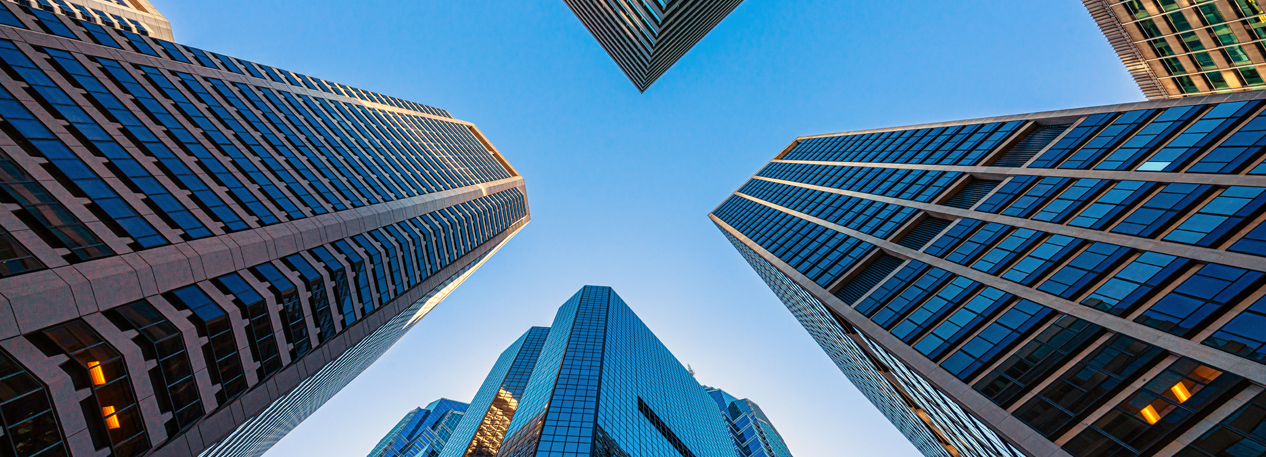 A skyward view of city buildings.