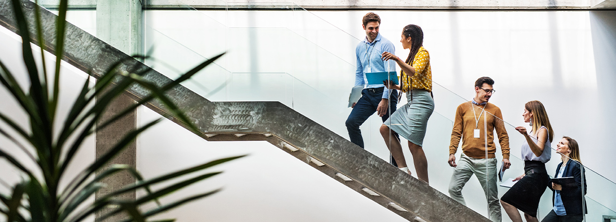 A group of people walking up a staircase.