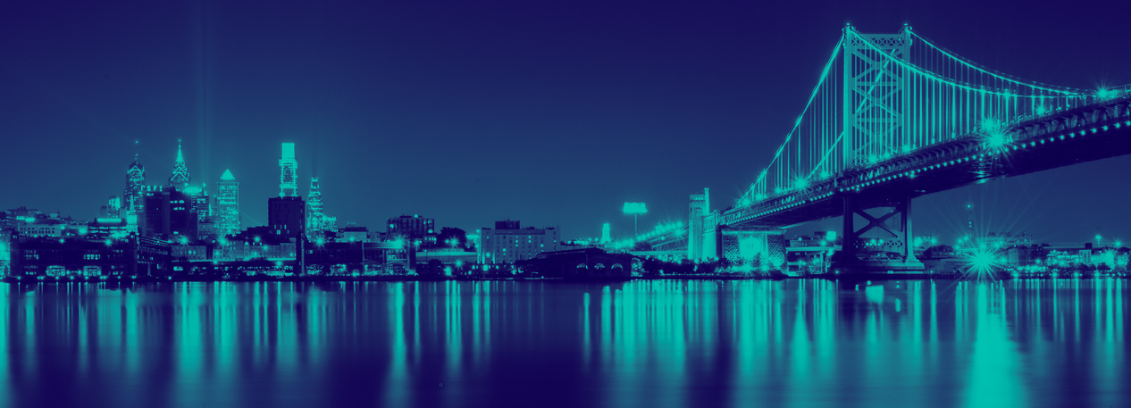 Philadelphia skyline with the Ben Franklin Bridge and Delaware River.