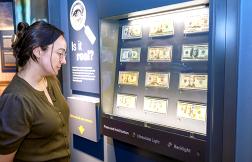 Four people watching the film in Money in Motion