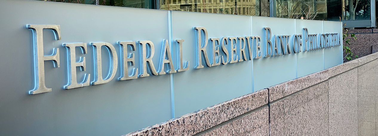 Sign that reads "Federal Reserve Bank of Philadelphia."