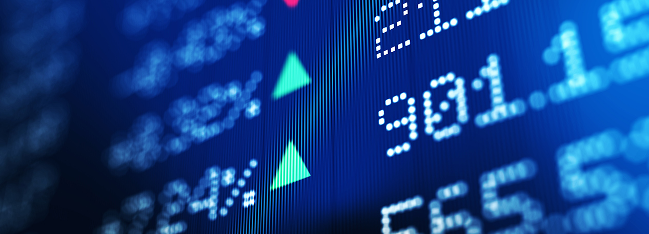 Close-up of electronic display screen with financial data, showing cost and percent change