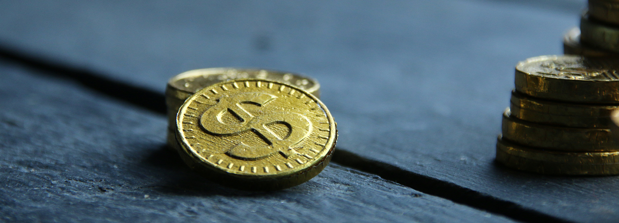 Stack of gold coins with dollar symbol
