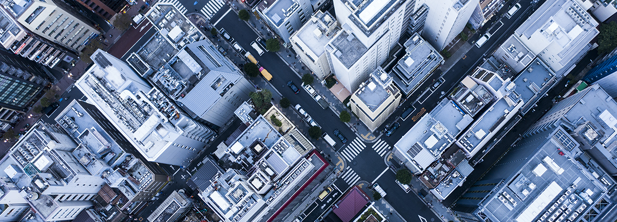 An aerial view of of a busy city block. 