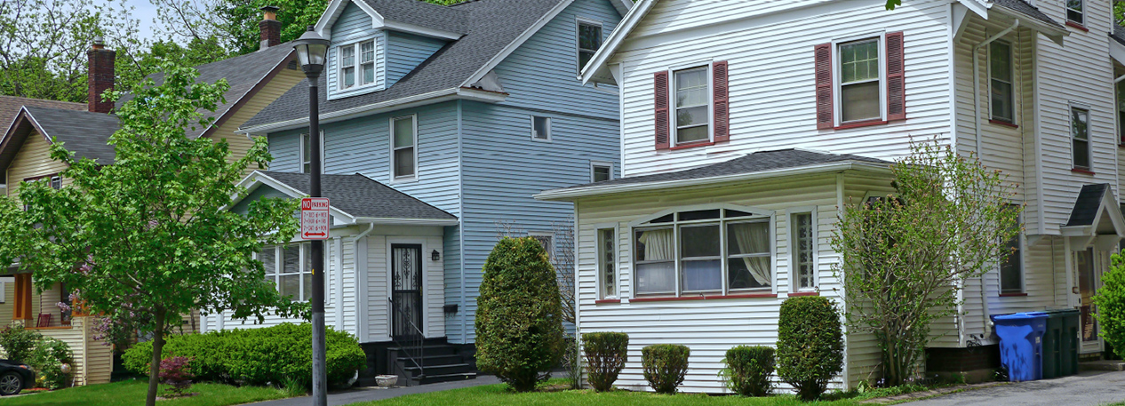 Suburban street with single-family, gabled houses