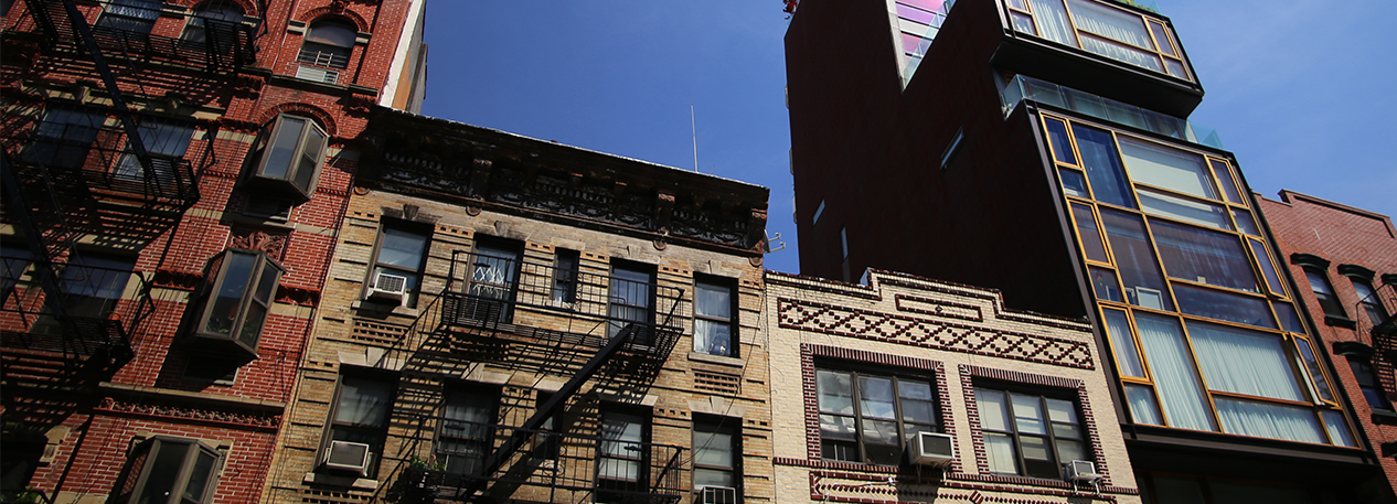 Old and new apartment buildings neighbor one another.