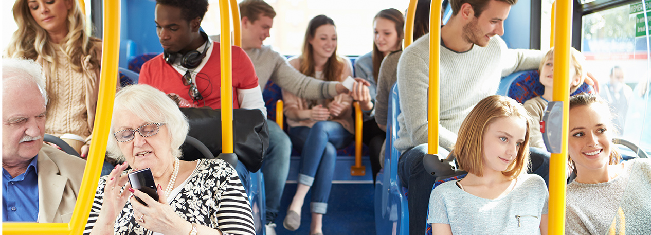 A group of passengers sitting on a bus.