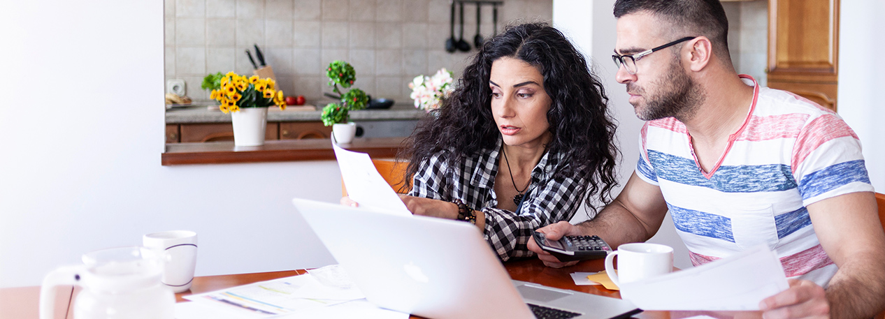 Couple looking at documents and financial bills