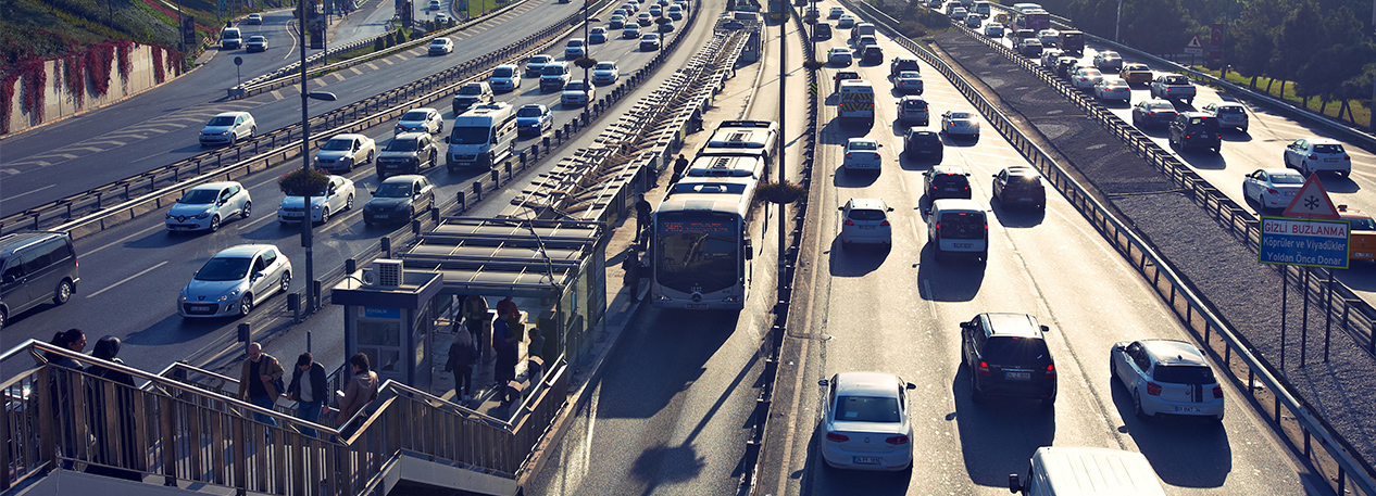 Multi-lane freeway with rapid transit bus stop in the middle