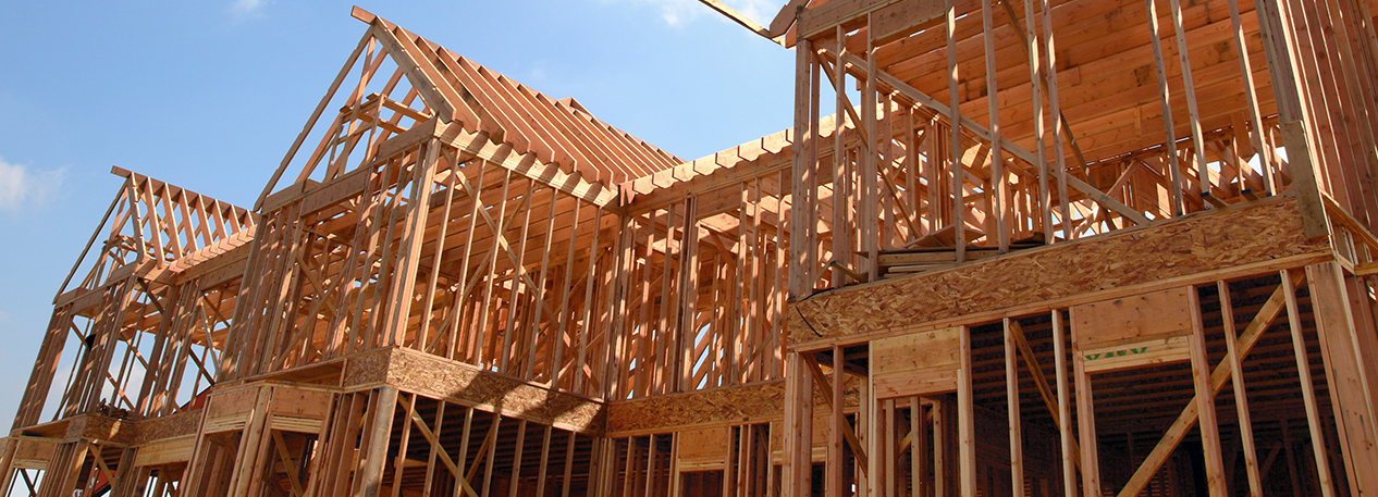 Framed out house with three gables, under construction