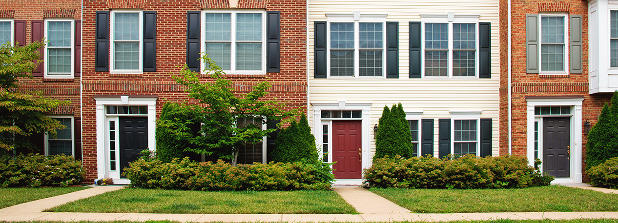 Top two stories of new looking townhouses