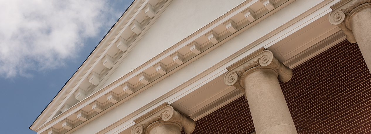 Building with white pediment on top of large white columns