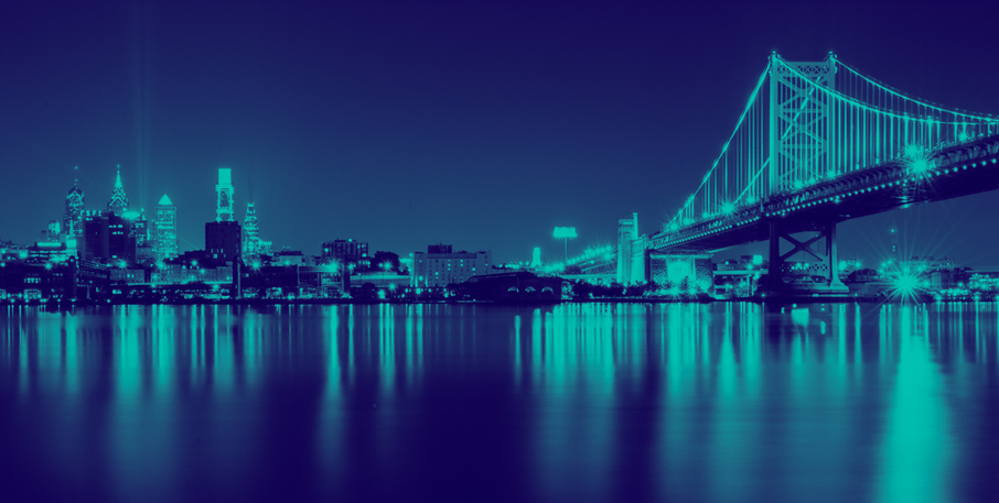 Philadelphia skyline with the Ben Franklin Bridge and Delaware River.