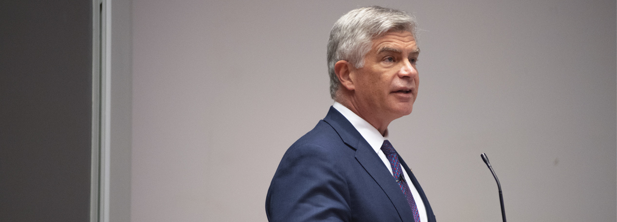 Federal Reserve Bank of Philadelphia President Patrick Harker standing at a podium