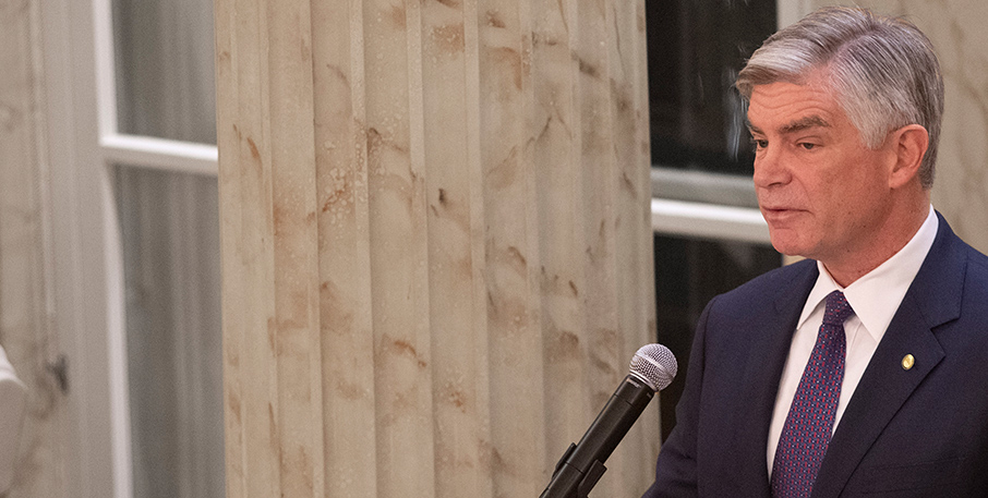 Federal Reserve Bank of Philadelphia President Patrick Harker speaking into a microphone