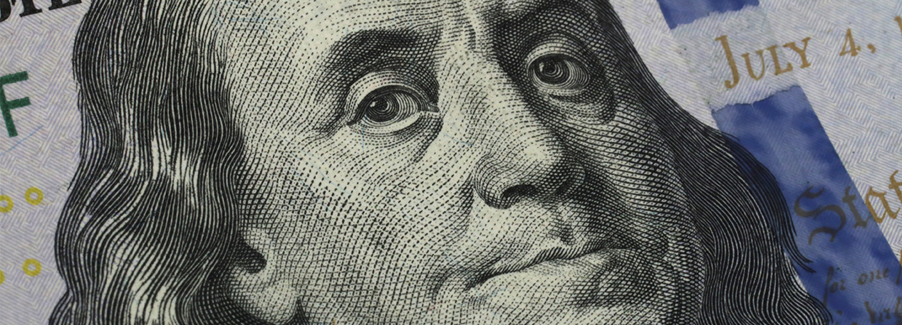 Close-up of Benjamin Franklin's portrait on the hundred-dollar bill