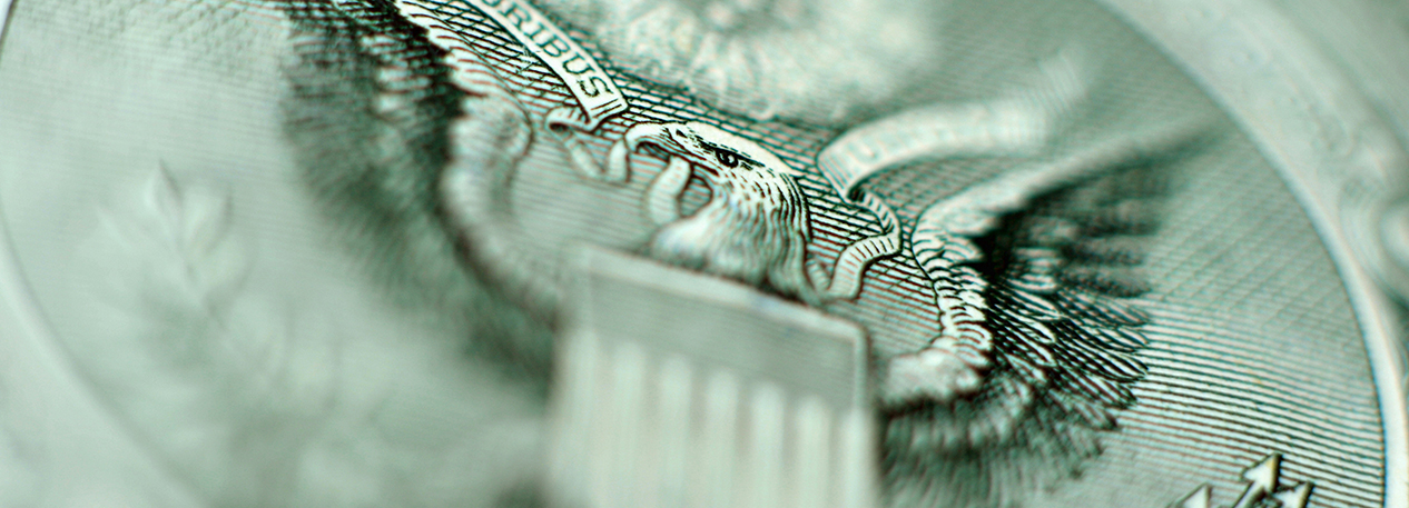 Close-up of the Great Seal of the United States on a dollar bill