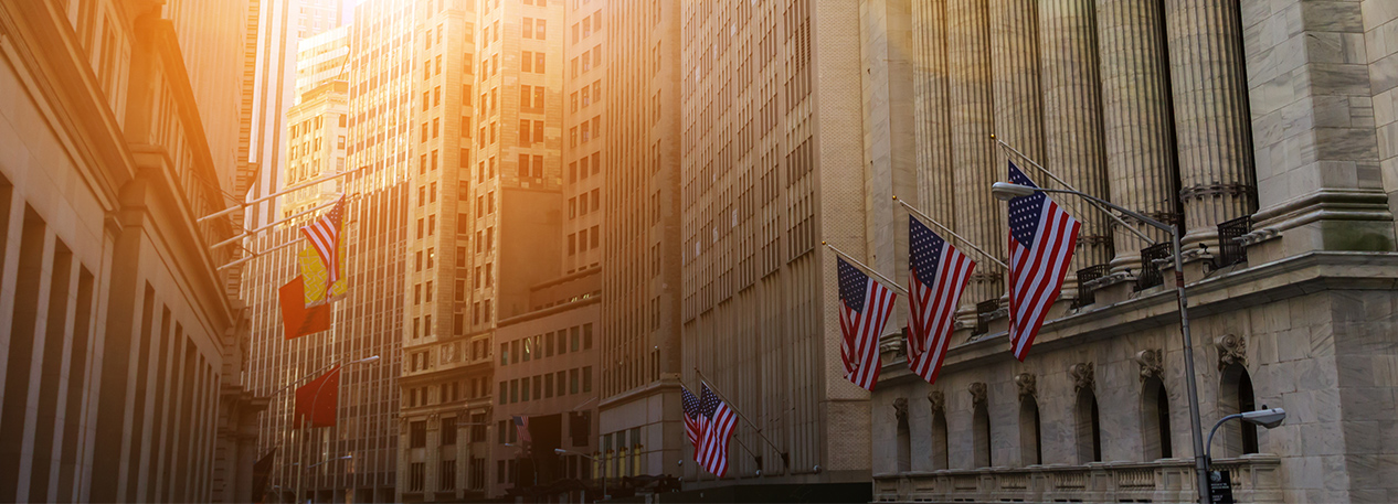 New York Stock Exchange Building and Wall Street at sunset