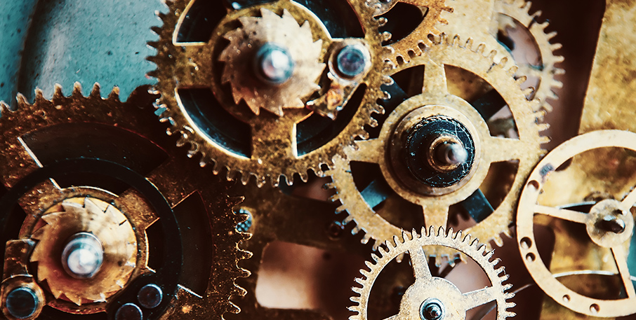 Mechanical gears working in unison.