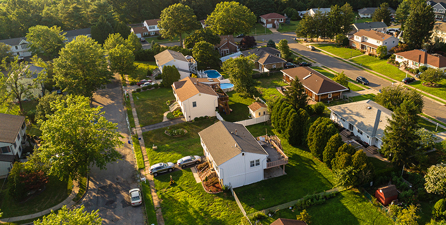 Aerial view of a block of suburban homes.