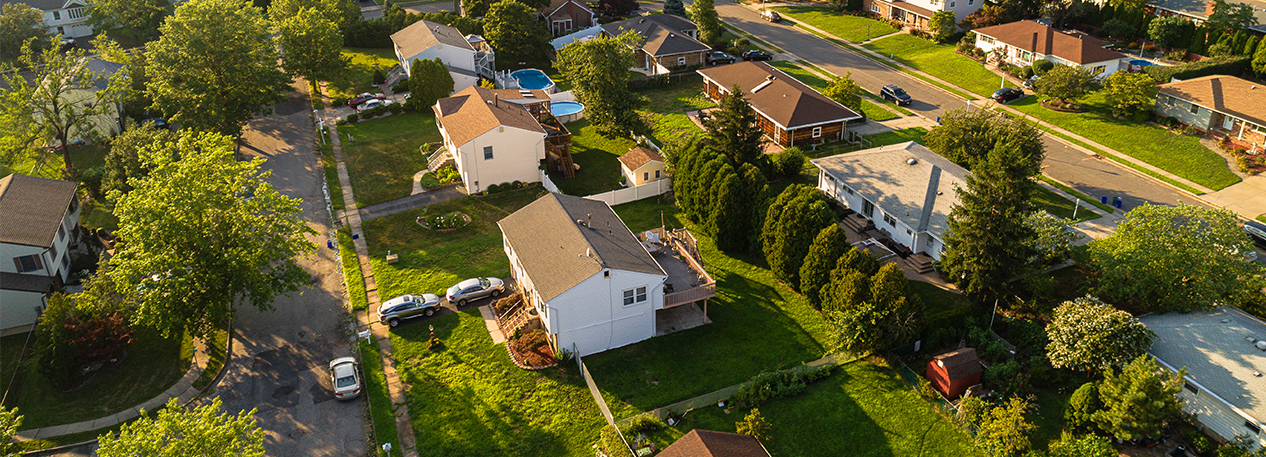 Aerial view of a block of suburban homes.