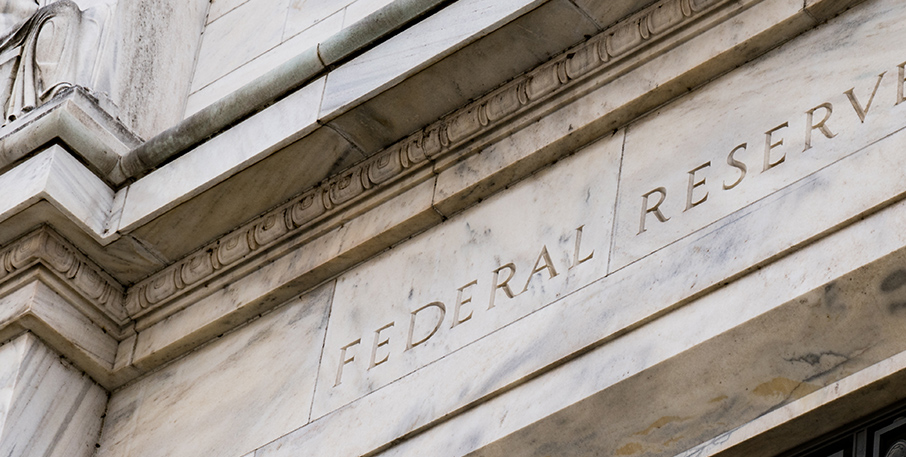 Marble building with the words "Federal Reserve" inscribed