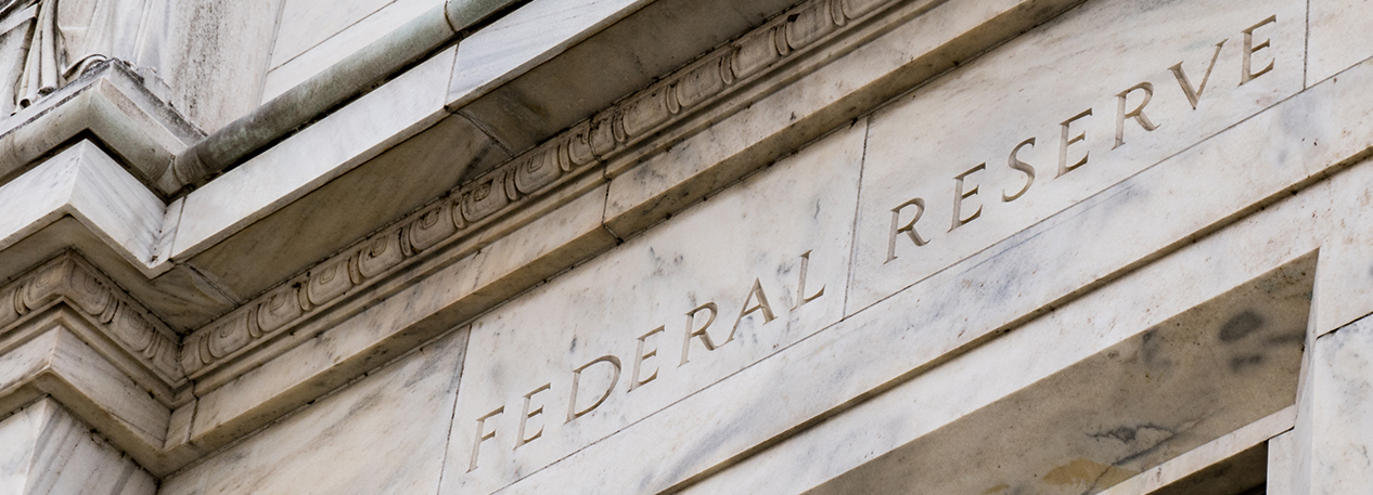 Marble building with the words "Federal Reserve" inscribed