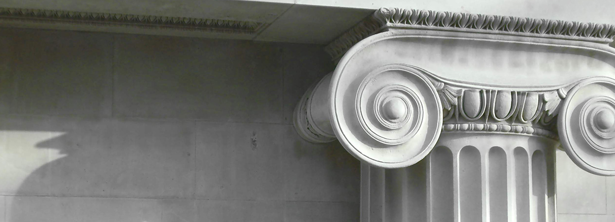 Top of fluted column with a volute