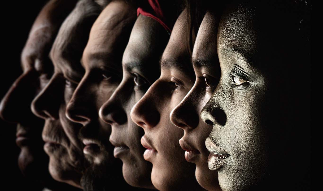 Six faces of diverse people in a row.