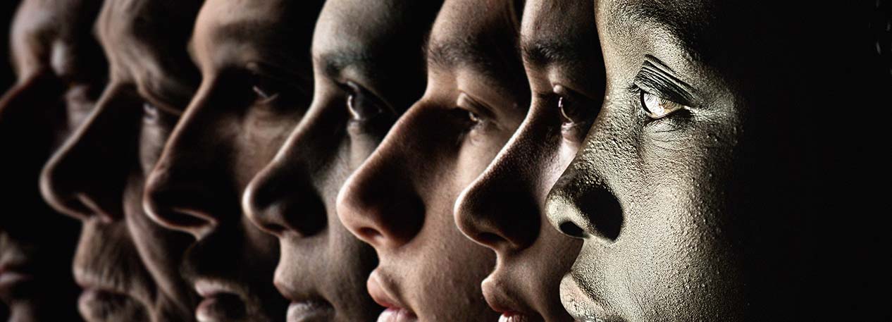 Six faces of diverse people in a row.