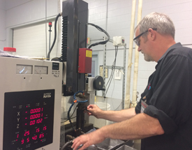 An apprentice in a HITEC apprenticeship program at Vermont Precision Tools.