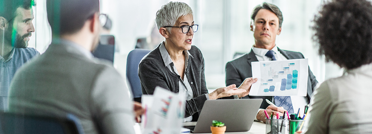 Group of co-workers collaborating at a table